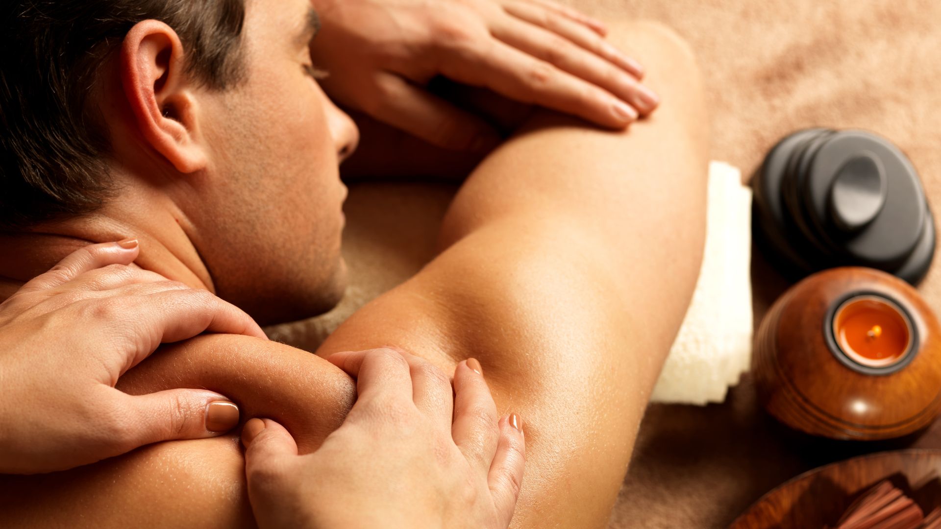 A man getting a back massage from a woman