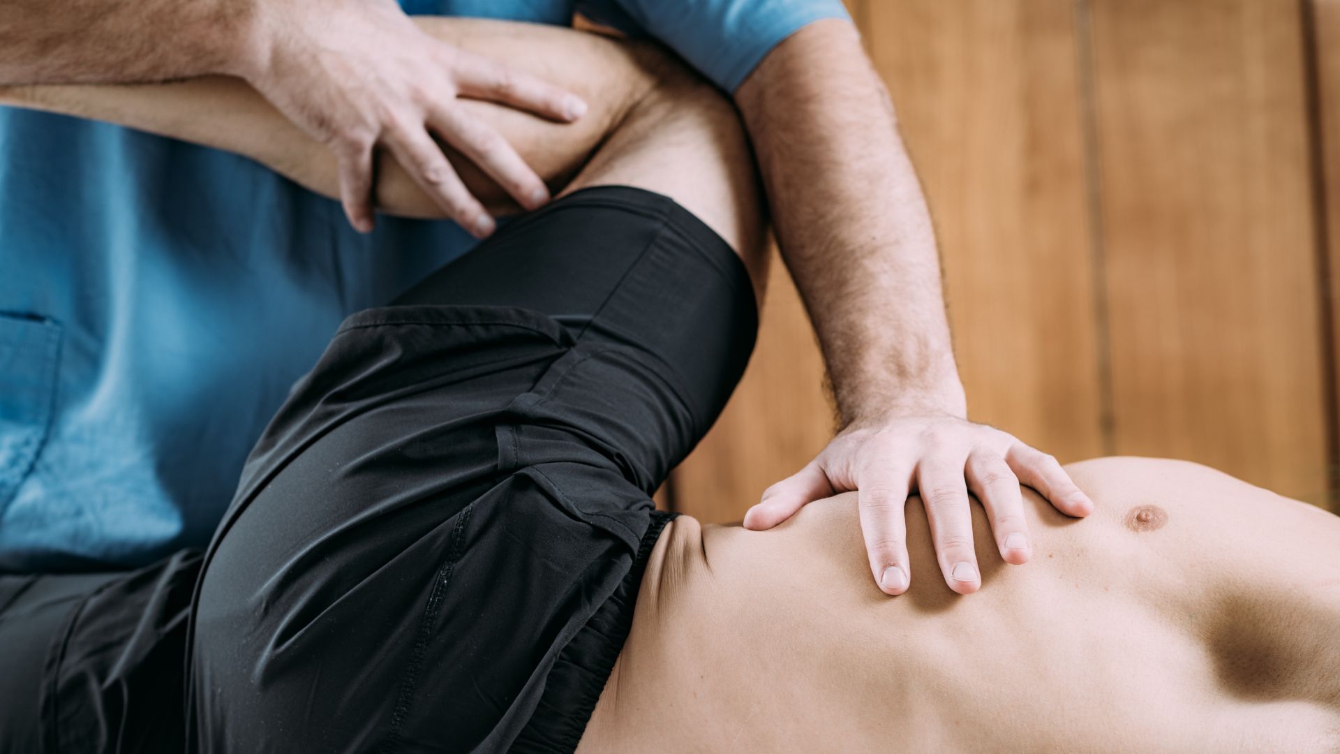 A man getting a back massage from another man